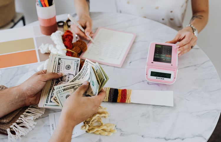 Client counting money and planning