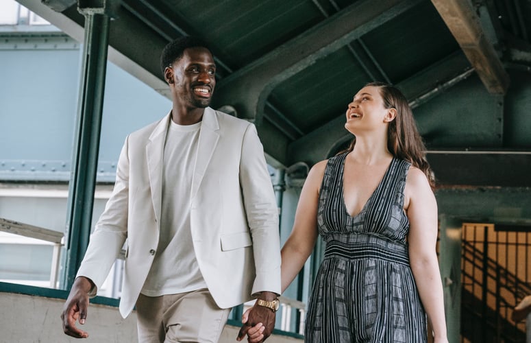 Couple-walking-together-holding-hands---Wedgewood-Weddings