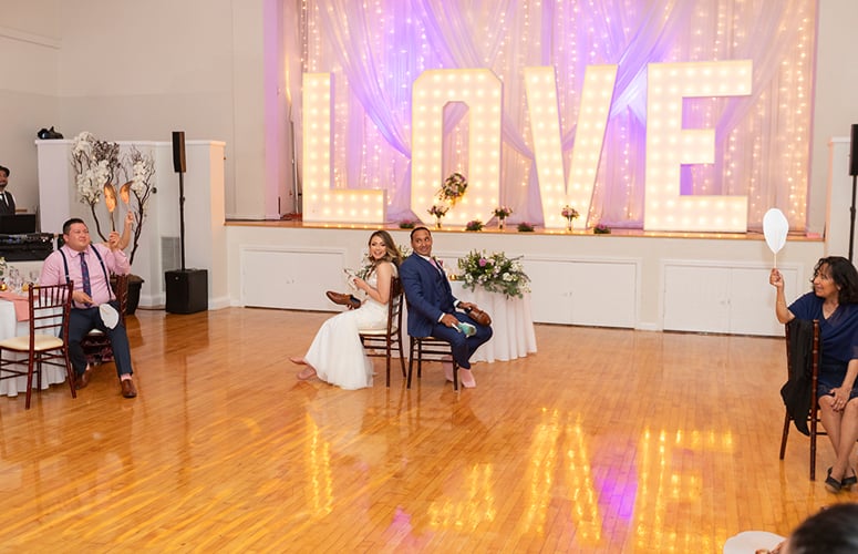 Newlyweds-enoy-shoe-game-during-wedding-reception-at-Cuvier-Club
