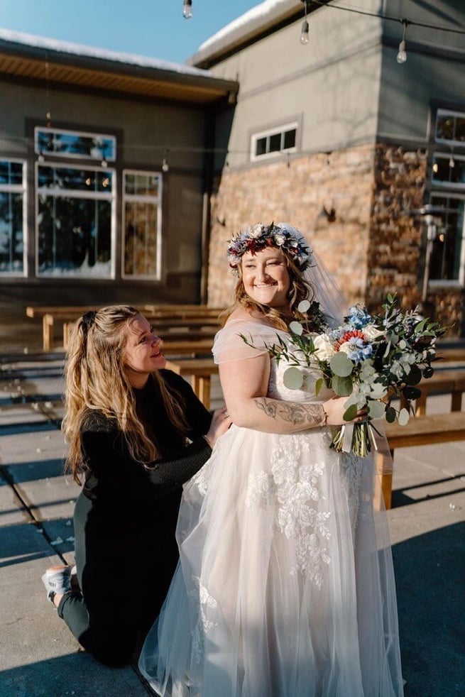 Team member coordinator Heidi helping bride