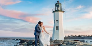 Couple kissing in front of Scutiate Lighthouse, Barker House by Wedgewood Weddings