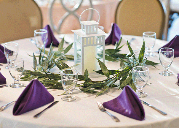 Purple Cloth Napkins with White Linen Table Scape