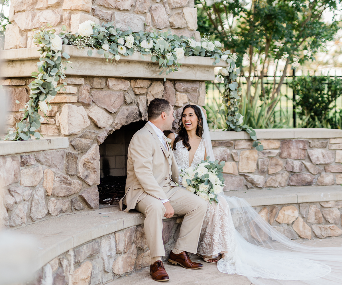 Couple at fireplace with greenery - Aliso Viejo by Wedgewood Weddings