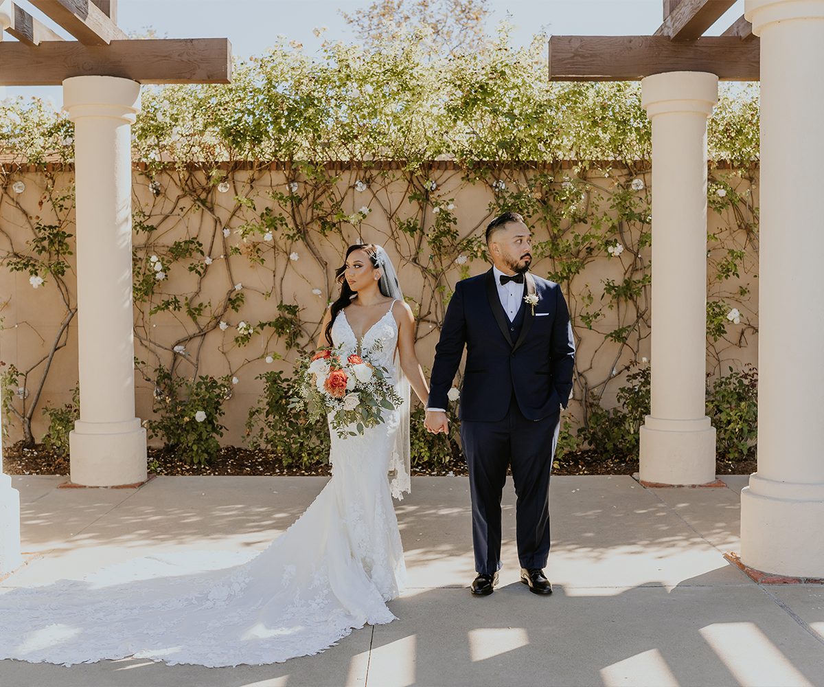 Couple in front of arbor lawn wall - Aliso Viejo by Wedgewood Weddings