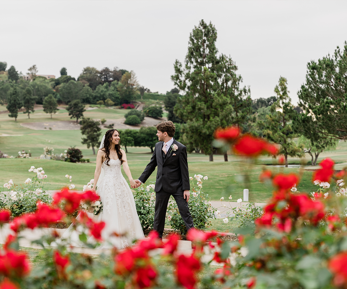 Couple with flowers & golf course views - Aliso Viejo by Wedgewood Weddings