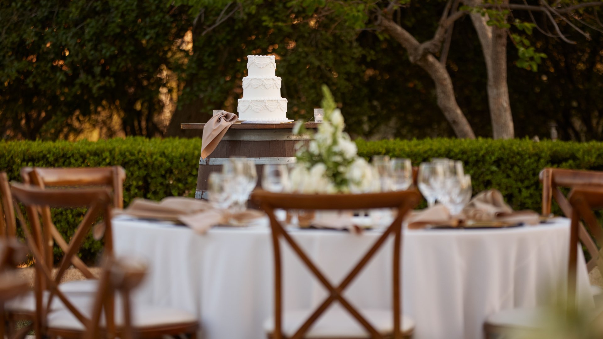 Outdoor Wedding Cake Display at Bel Vino Winery Reception Courtyard