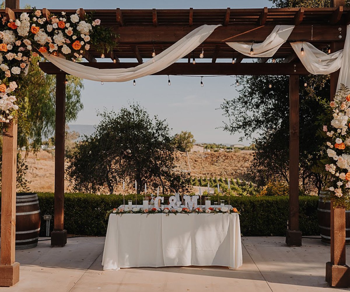 Sweetheart table with drapery & floral - Bel Vino Winery by Wedgewood Weddings