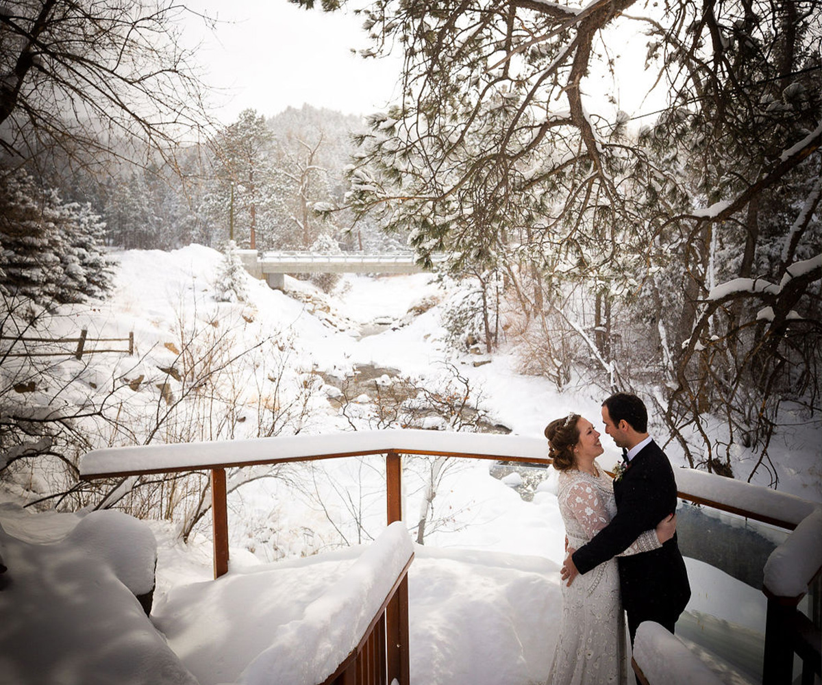 Couple in snow by creek - Boulder Creek by Wedgewood Weddings