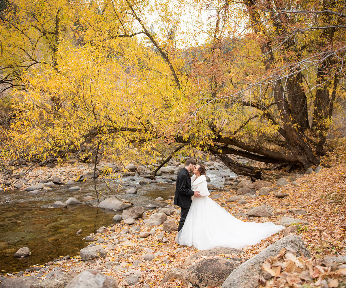 Picturesque Fall Creekside Wedding Space at Boulder Creek, Framed by Autumn Forest and Glowing Colorado Foliage