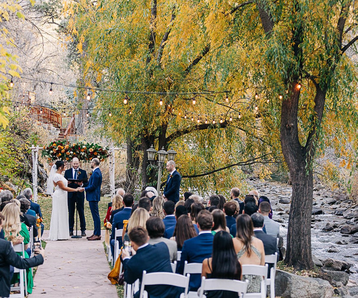 Romantic Creekside Wedding Setup with Rustic Chairs and Flowing Brook at Boulder Creek