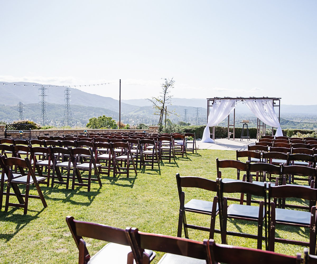 Gorgeous outdoor ceremony with arch and views at Boulder Ridge by Wedgewood Weddings