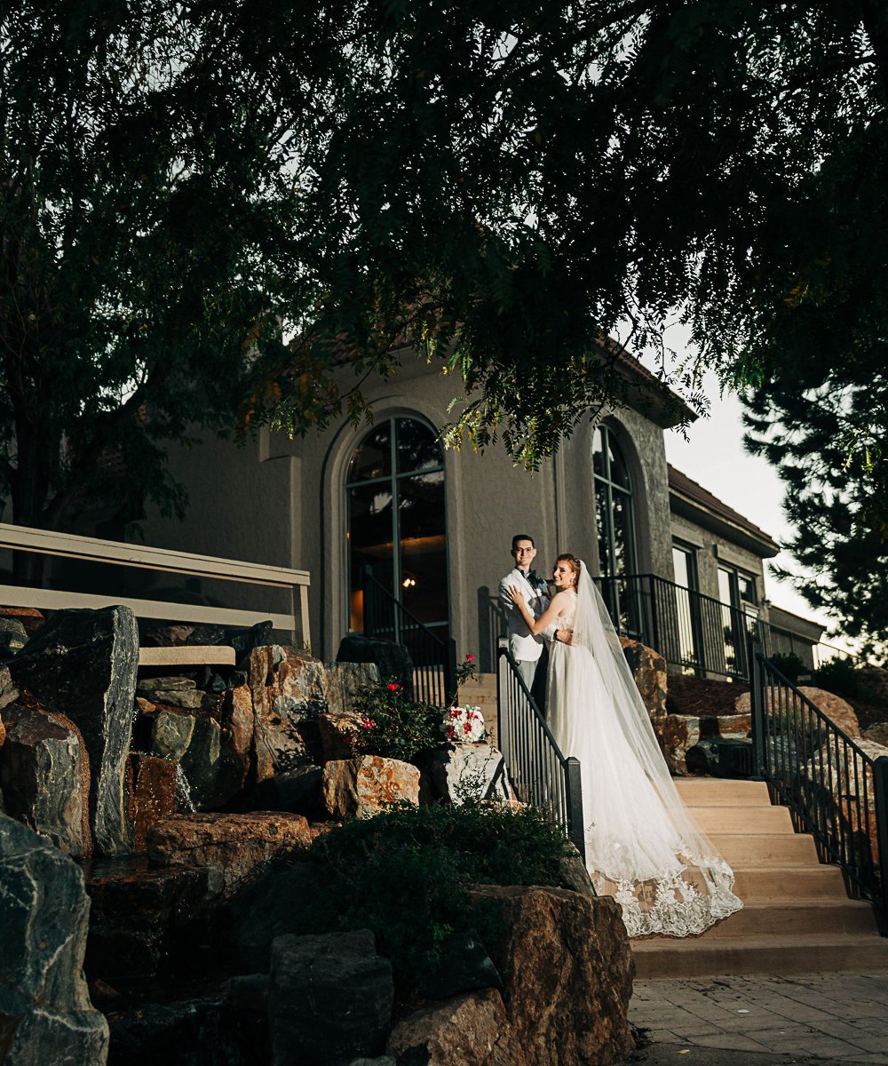 Couple in front of Brittany Hill by Wedgewood Weddings