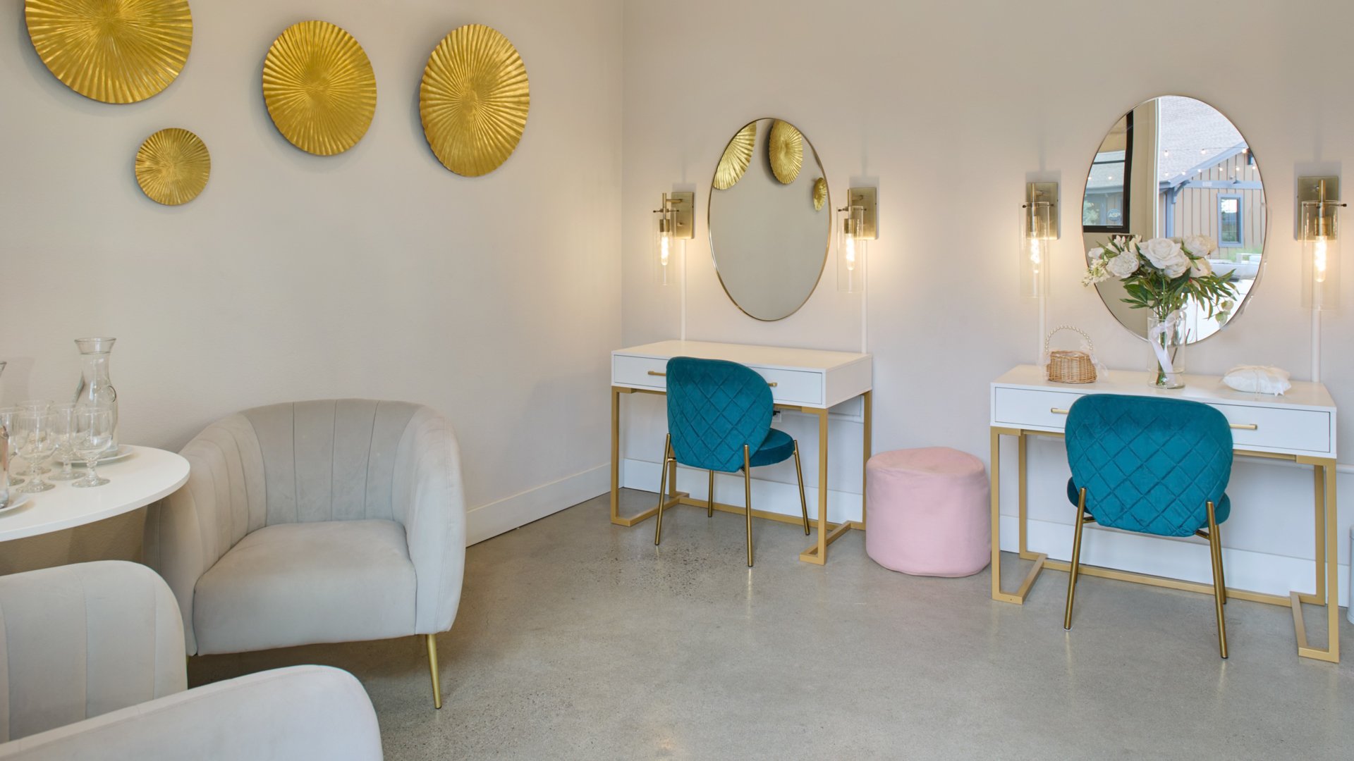 Bridal suite featuring vanity tables, blue velvet chairs, and gold décor accents at Canopy Grove in Escondido, CA.
