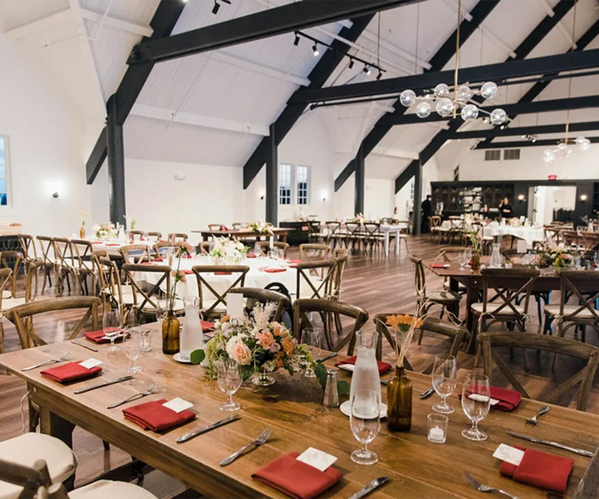 Grand hall with farm tables - Carlsbad Windmill by Wedgewood Weddings