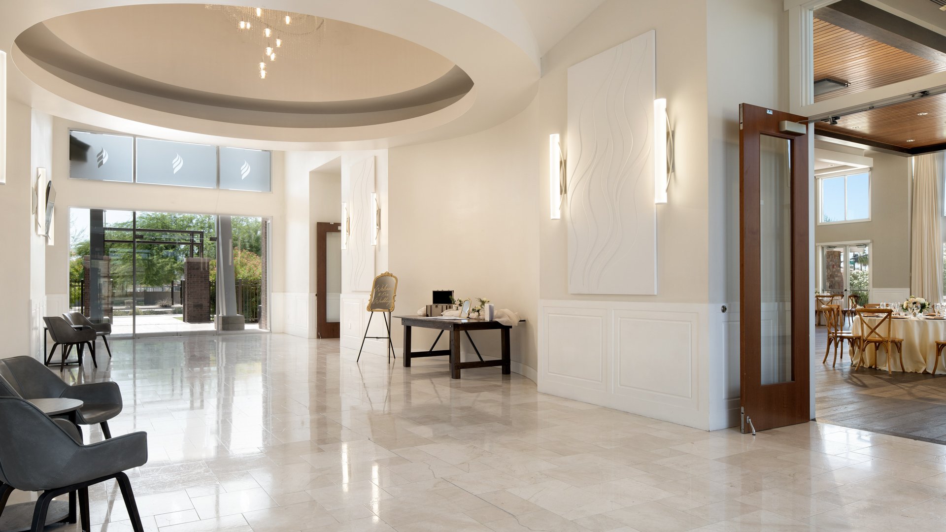 Wedding lobby entrance at Colby Falls Arizona featuring modern décor, marble floors, and a welcoming space for arriving guests.