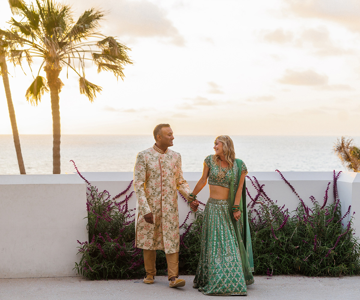 Couple in cultural dress by beach - Cuvier Club by Wedgewood Weddings