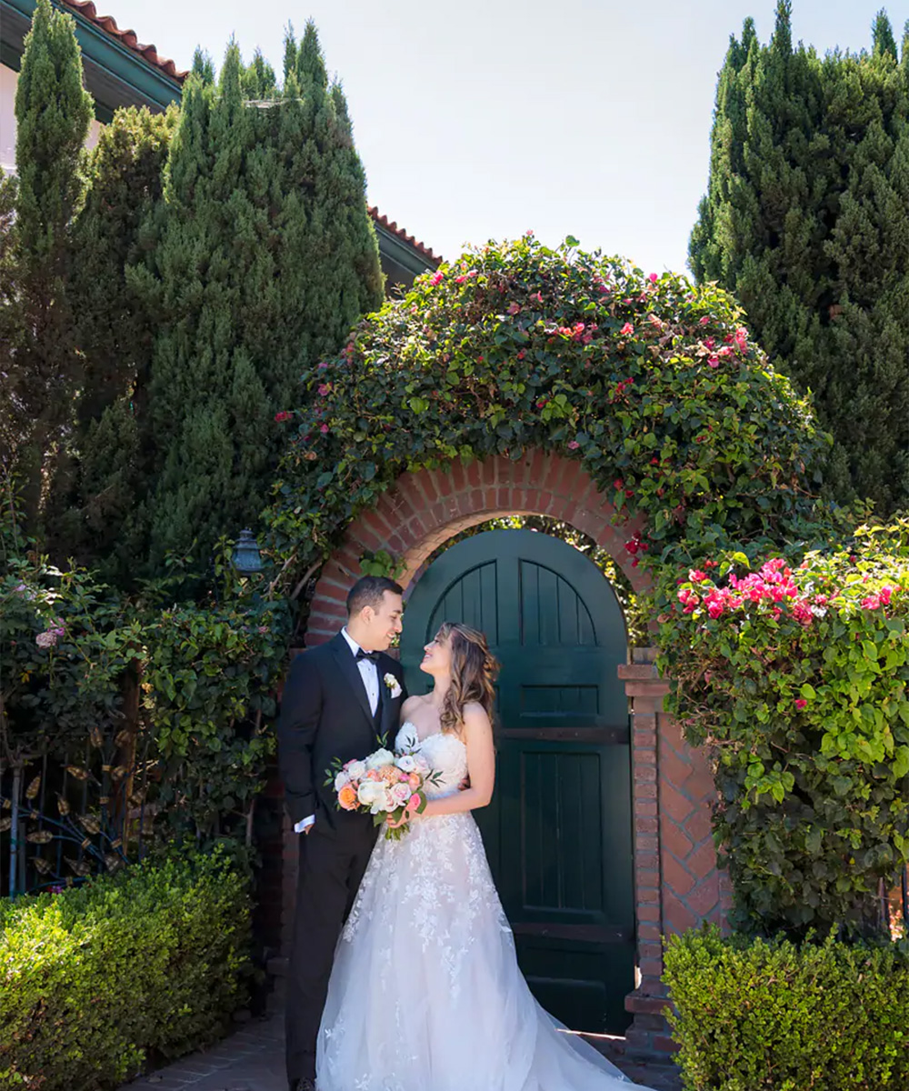 Couple in front of door and greenery - Cuvier Club by Wedgewood Weddings