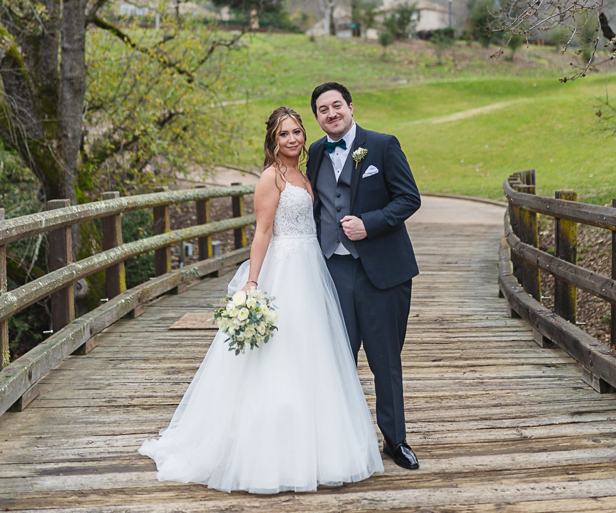 Couple on bridge at Eagle Ridge by Wedgewood Weddings