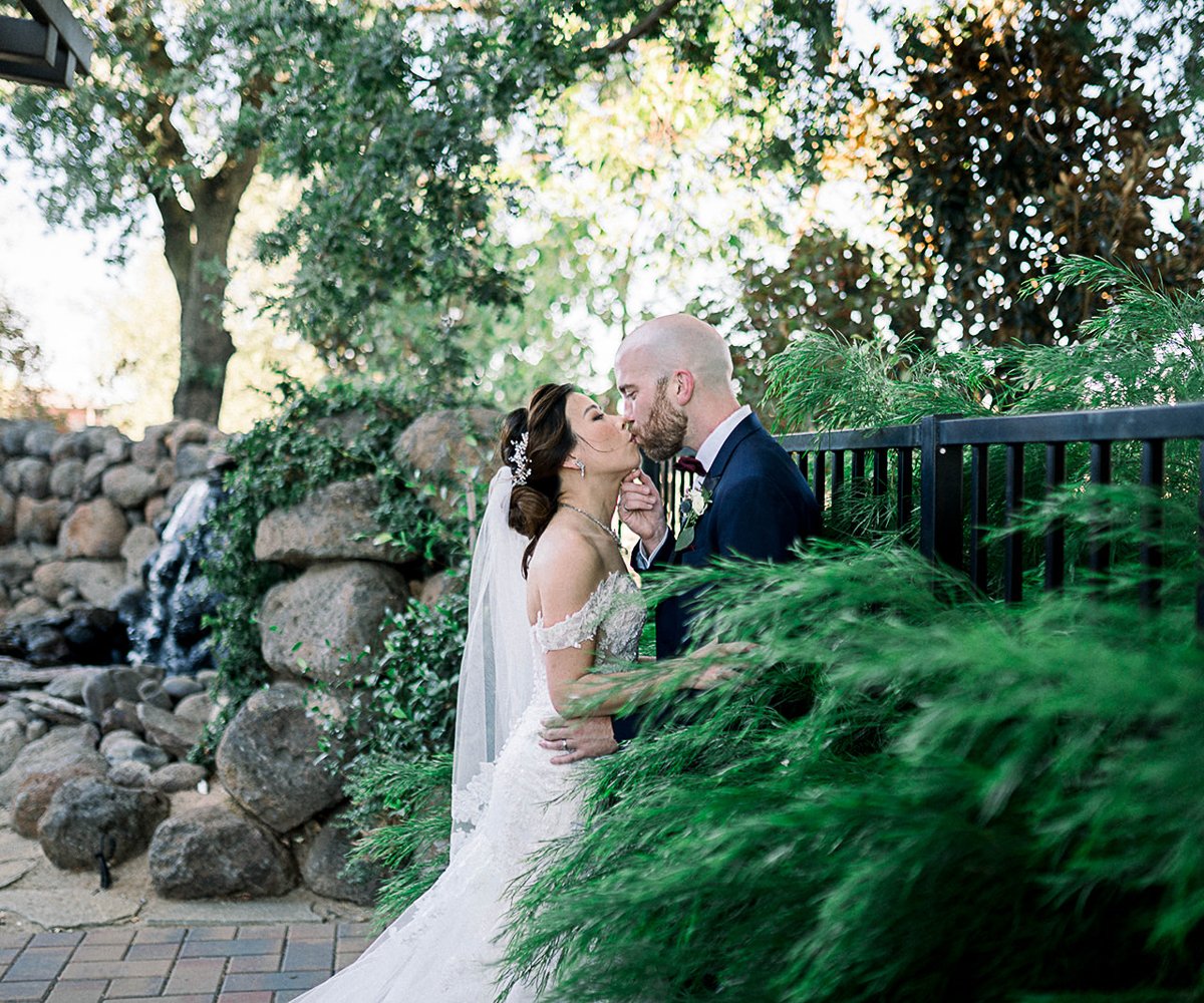Couple at Waterfall Arbor - Evergreen Springs by Wedgewood Weddings