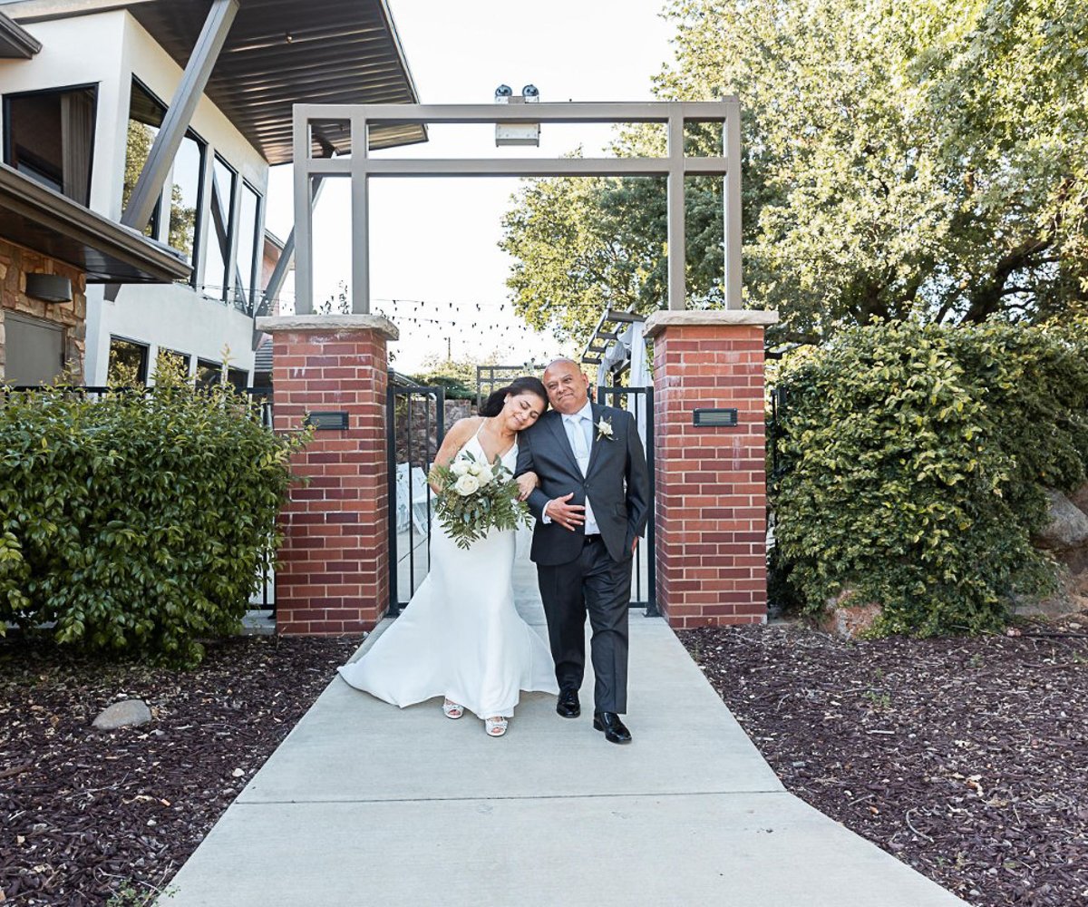Couple by brick at Evergreen Springs by Wedgewood Weddings