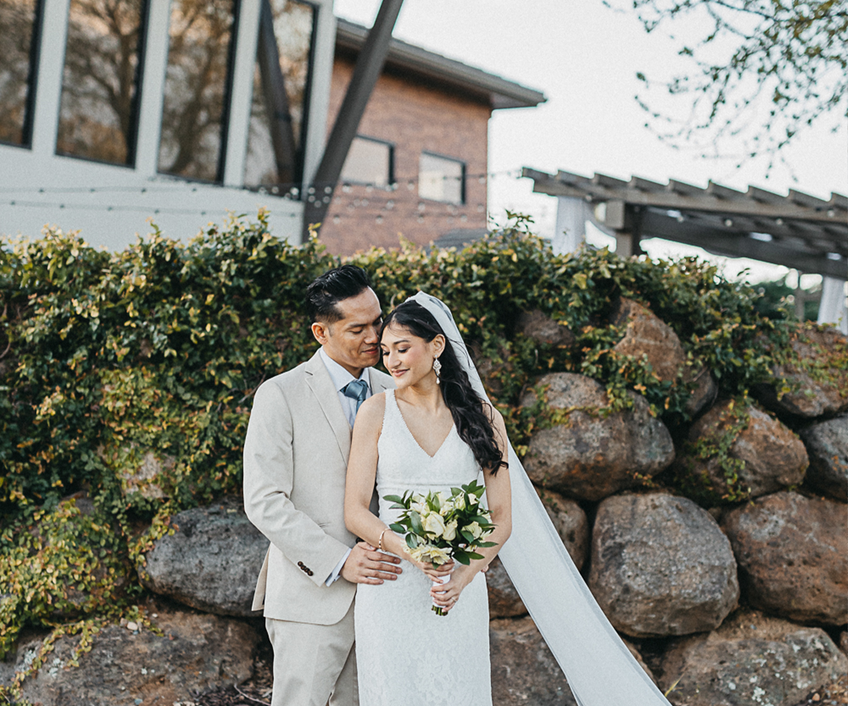 Couple in front of Evergreen Springs by Wedgewood Weddings