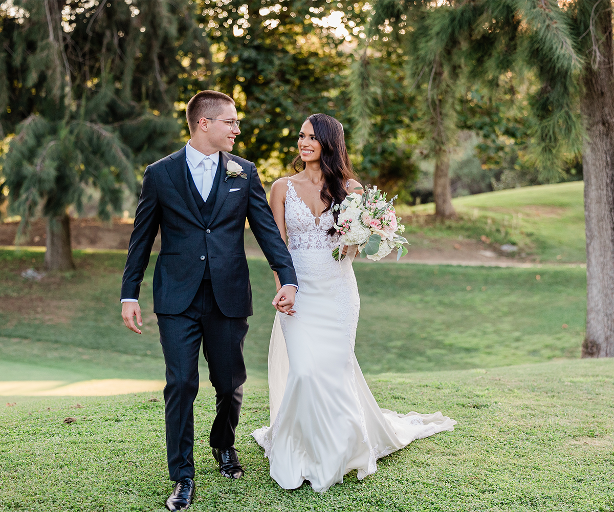 Wedding couple outside with greenery at Fallbrook Estate by Wedgewood Weddings