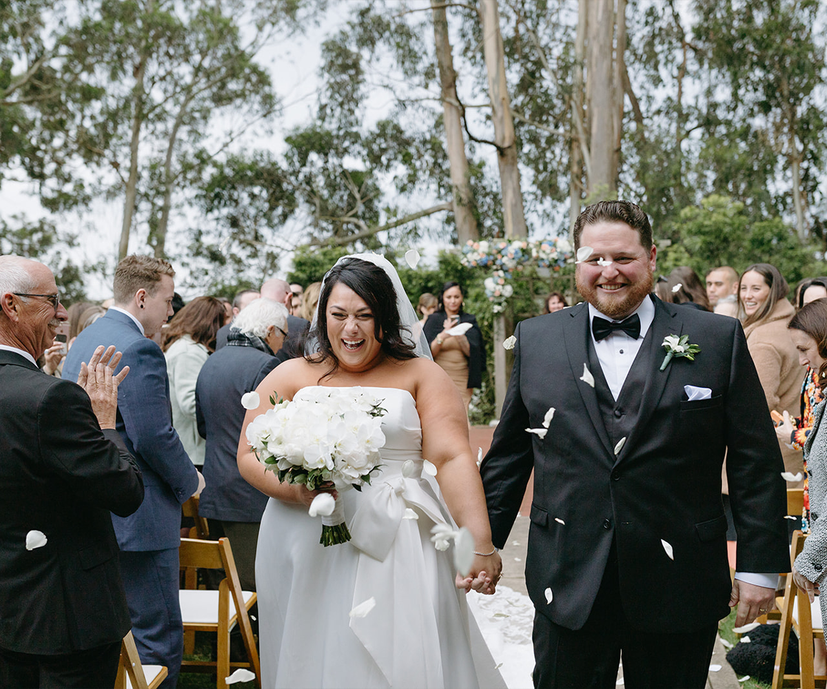 Couple exiting garden ceremony at Golden Gate Club at the Presidio