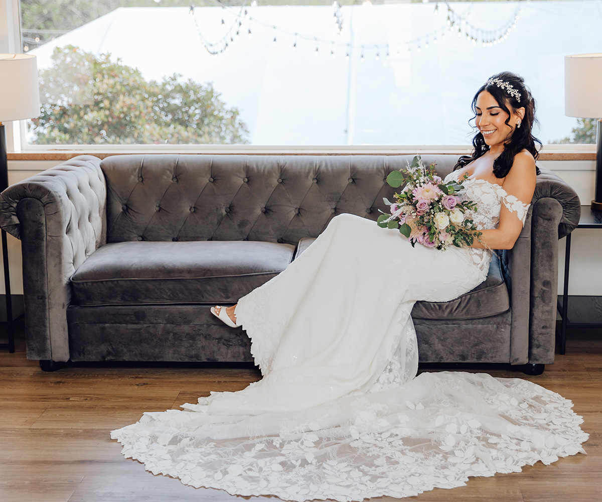 Bride on couch in get ready room - Hacienda de las Flores by Wedgewood Weddings