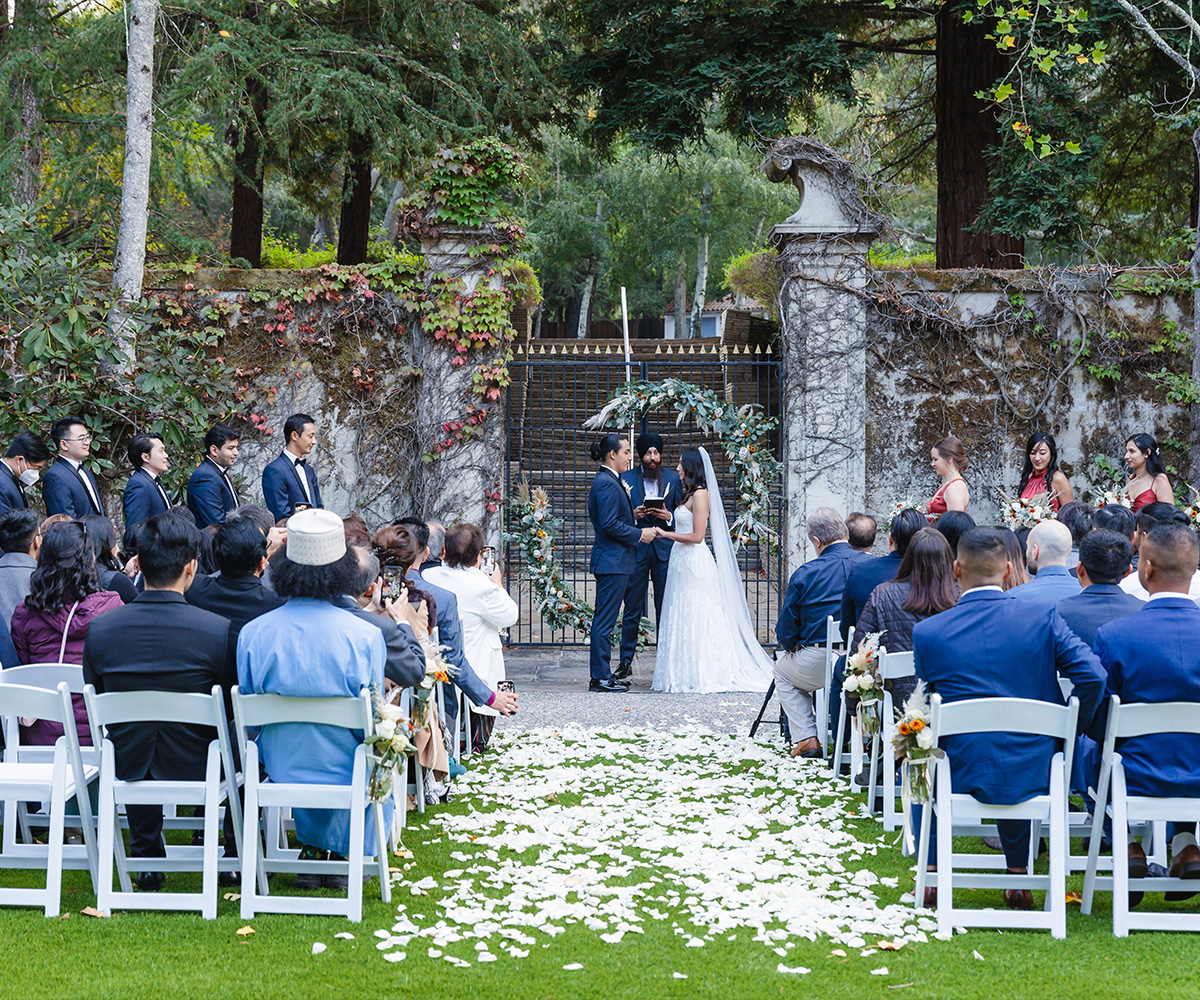 Ceremony in front of gates - Hacienda de las Flores by Wedgewood Weddings