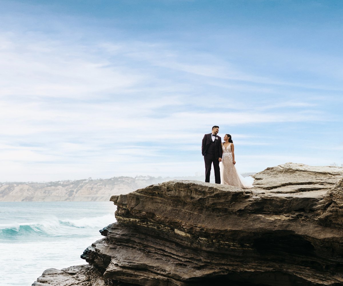 Bride and groom posing on La Jolla cliff - La Jolla Cove Rooftop by Wedgewood Weddings - 1