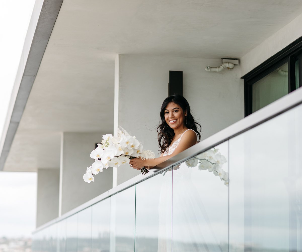 Bride smiling from hotel terrace - La Jolla Cove Rooftop by Wedgewood Weddings - 1