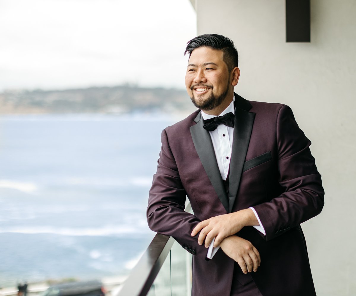 Groom posing on get-ready room balcony - La Jolla Cove Rooftop by Wedgewood Weddings - 1