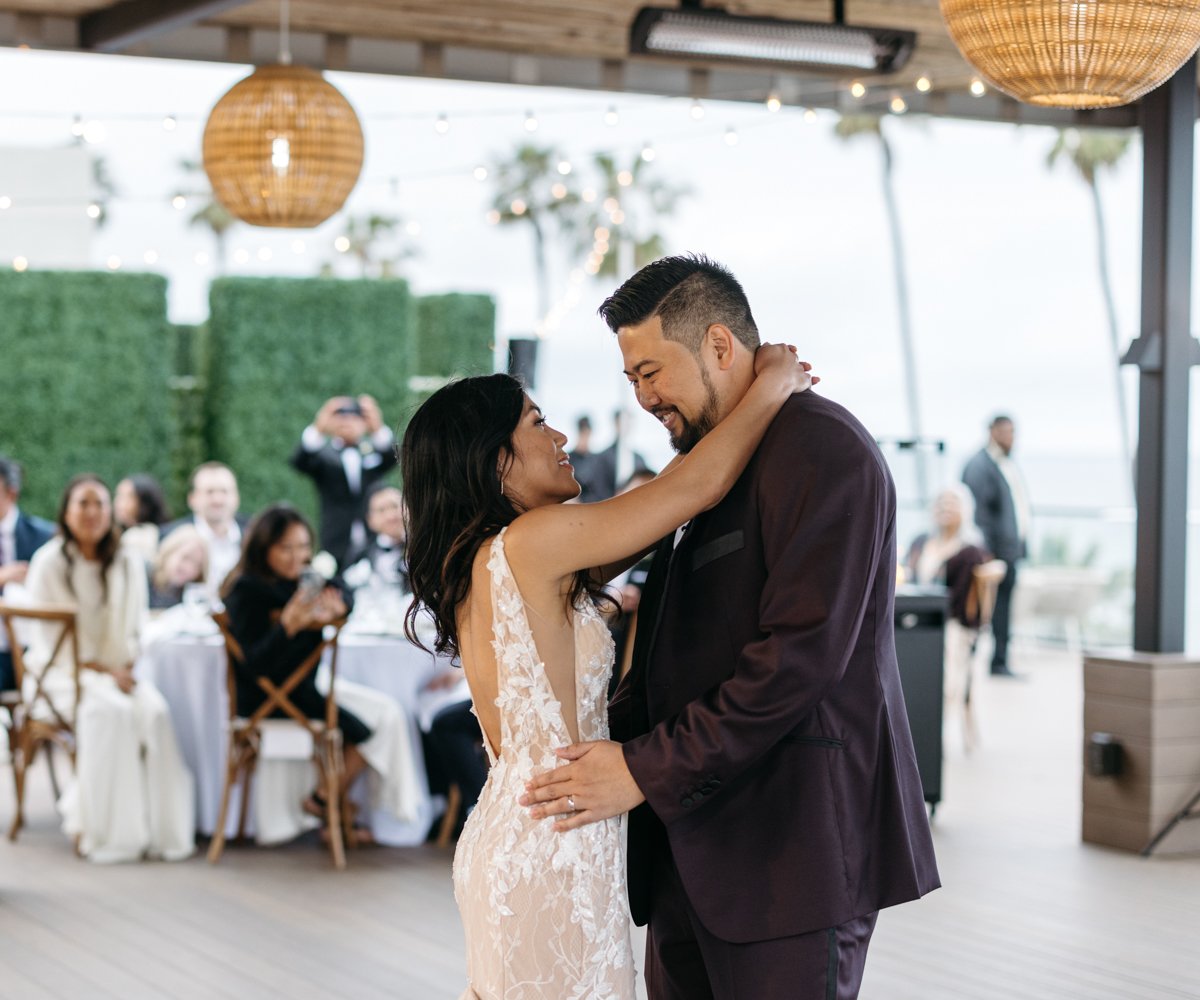 Newlyweds enjoying first dance - La Jolla Cove Rooftop by Wedgewood Weddings - 1