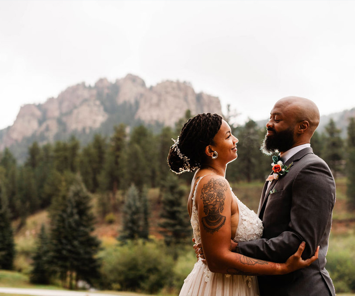 Couple in front of mountains at Mountain View Ranch by Wedgewood Weddings