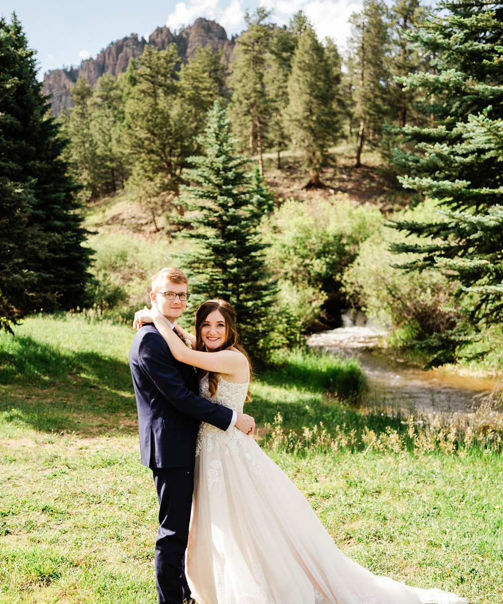 Couple in greenery with mountains - Mountain View Ranch by Wedgewood Weddings
