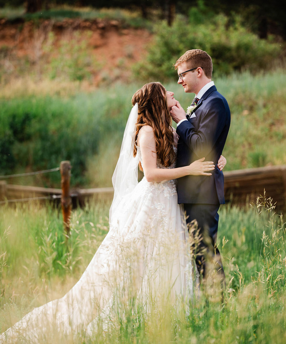 Couple in meadow - Mountain View Ranch by Wedgewood Weddings