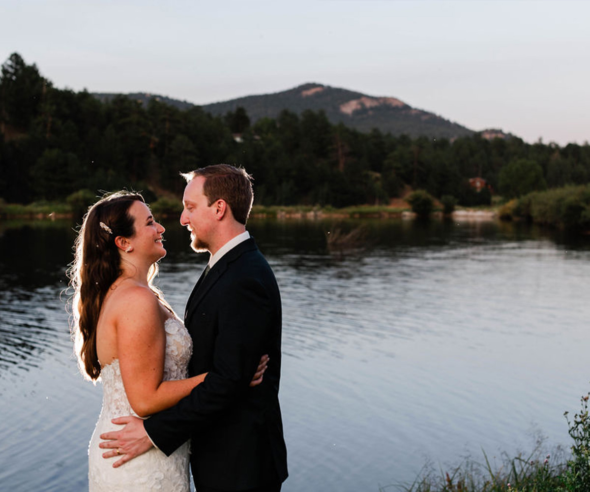 Couple by lake at Mountain View Ranch by Wedgewood Weddings