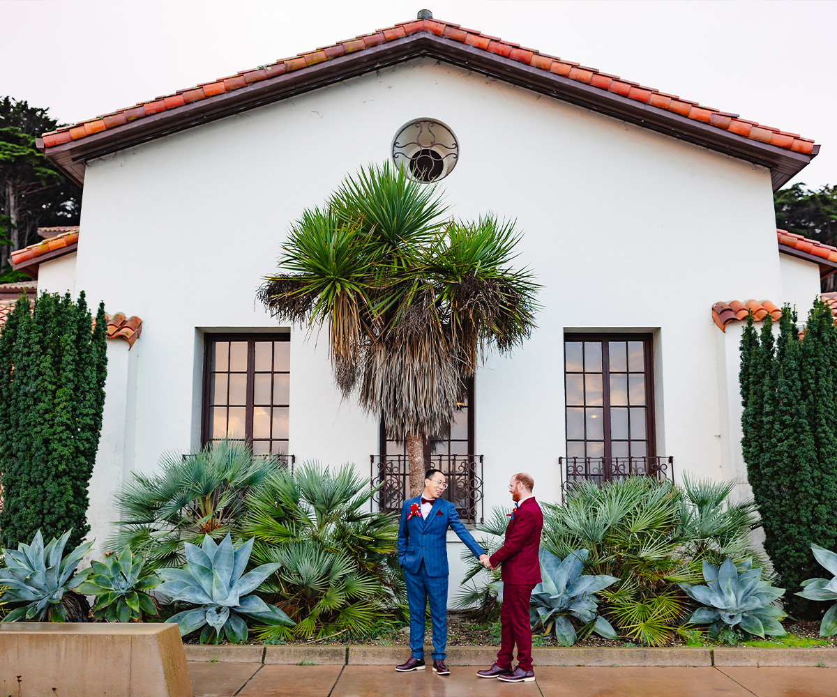 Couple in front of Officers Club by Wedgewood Weddings