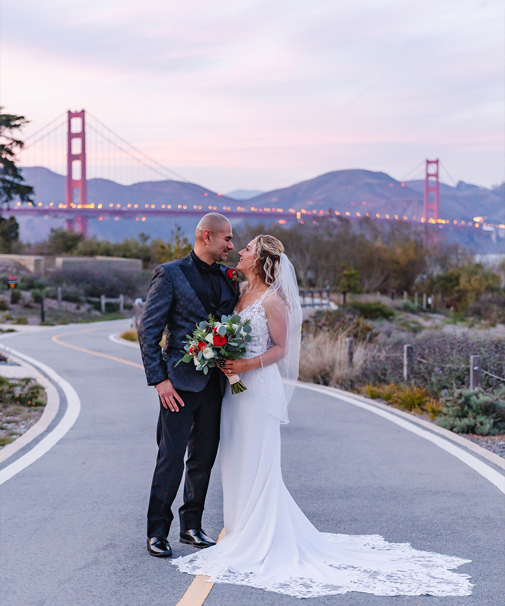 Couple with evening view of Golden Gate Bridge - Officers Club by Wedgewood Weddings