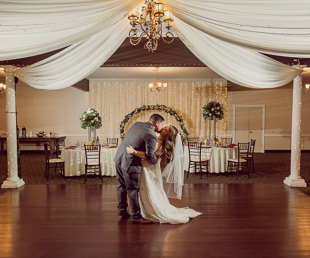 Couple kissing on dance floor at Redwood Canyon by Wedgewood Weddings