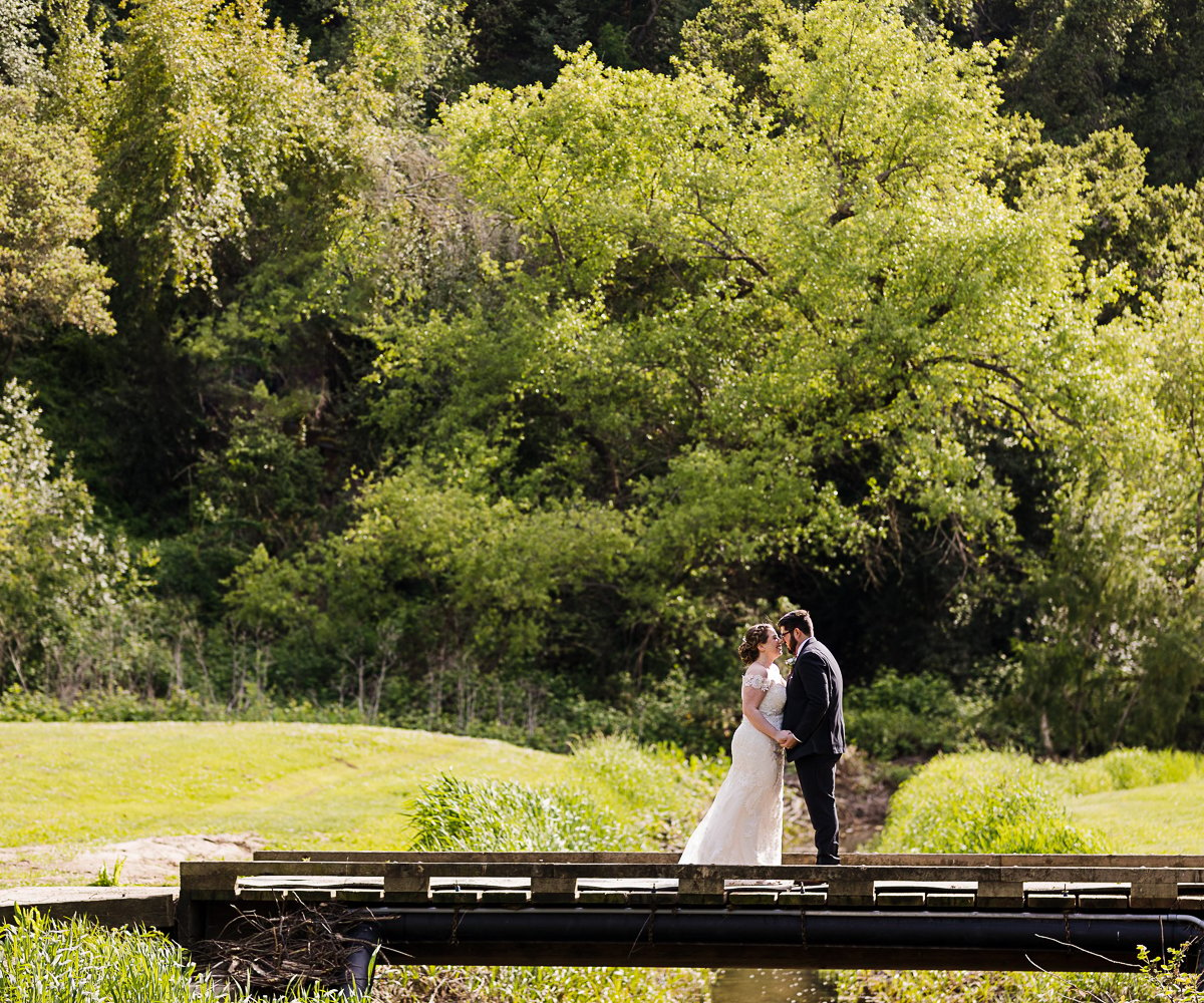 Couple on bridge photo op - Redwood Canyon by Wedgewood Weddings