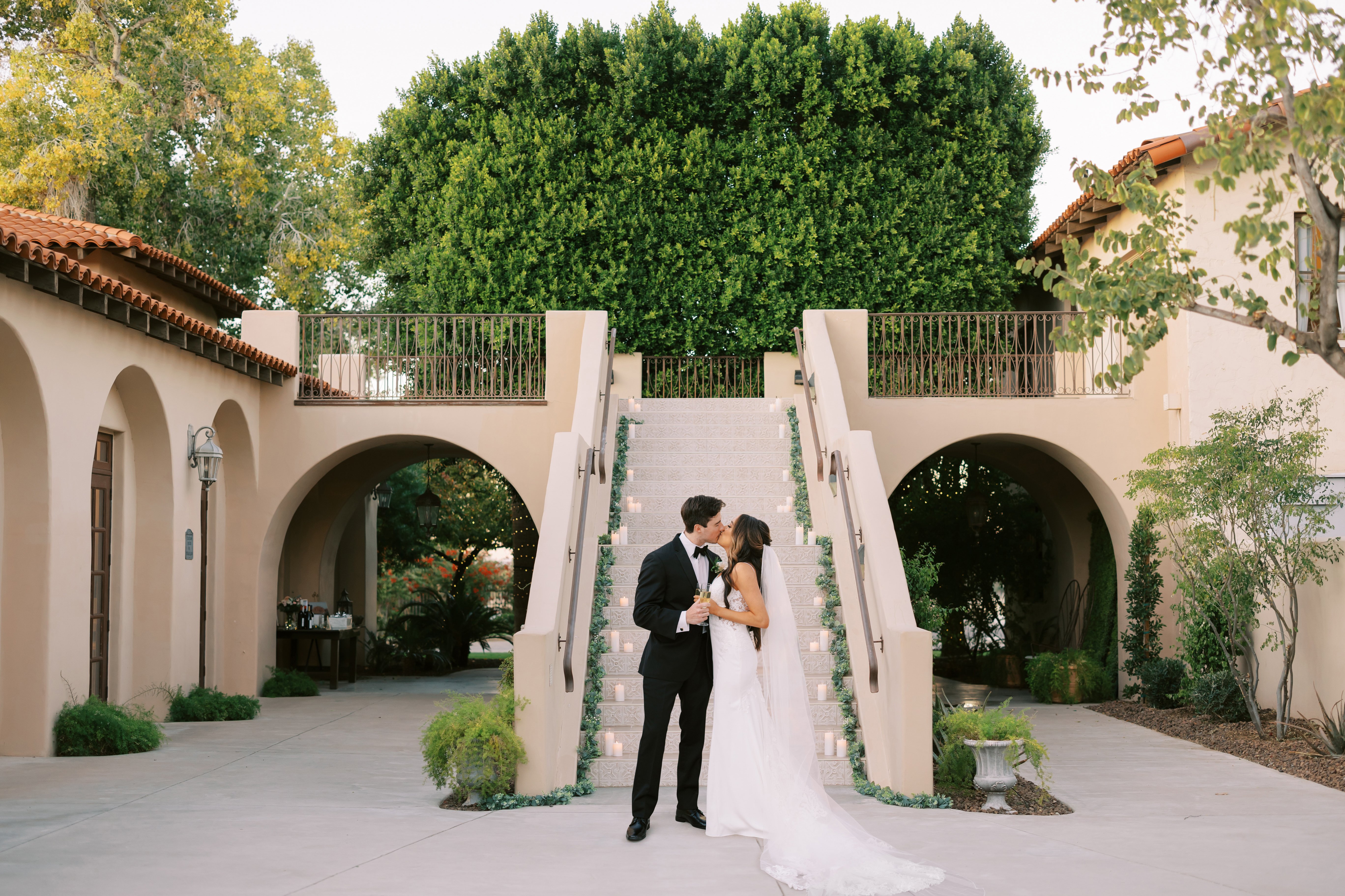 Couple in front of dramatic staircase at Secret Garden