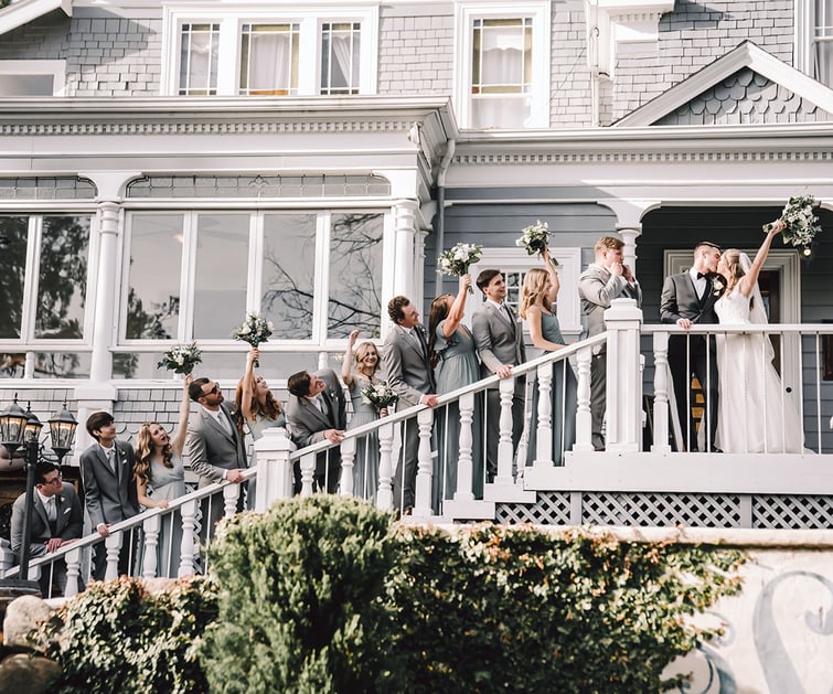 A wedding party on the staircase at Sequoia Mansion by Wedgewood Weddings