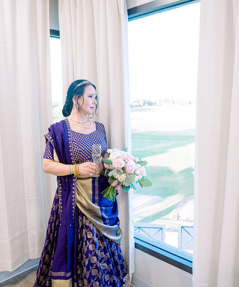 Bride looking at window in get ready room - Stallion Mountain by Wedgewood Weddings