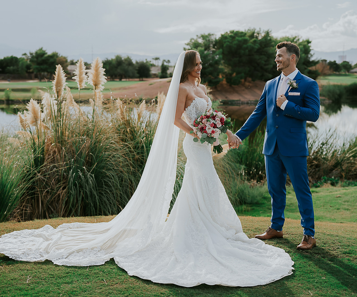 Couple by pampas grass and lake- Stallion Mountain by Wedgewood Weddings