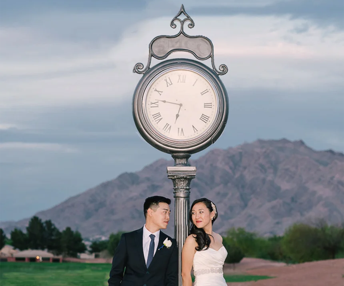 Couple in front of clock photo op - Stallion Mountain by Wedgewood Weddings