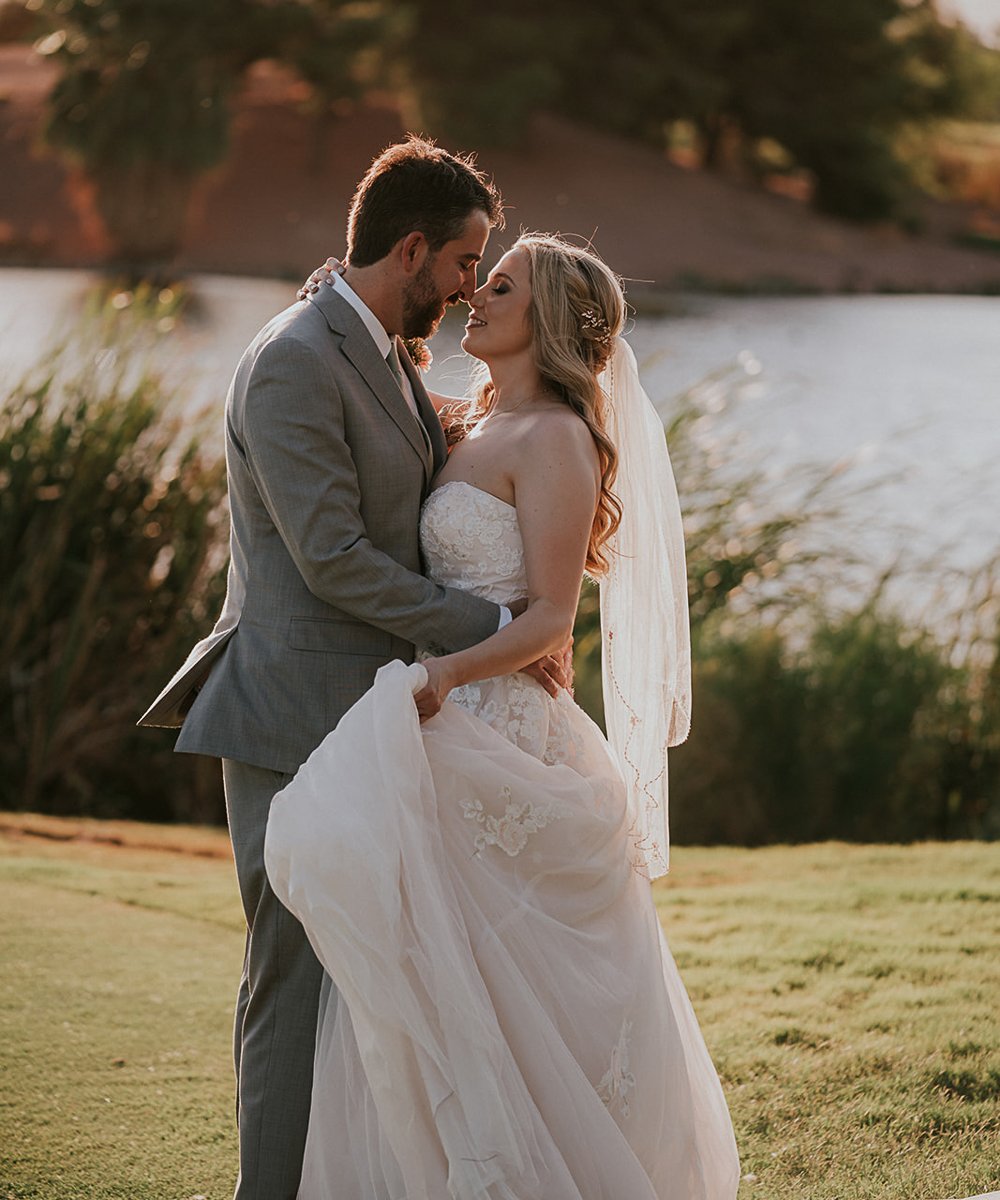 Couple posing by lake at golden hour - Stallion Mountain by Wedgewood Weddings