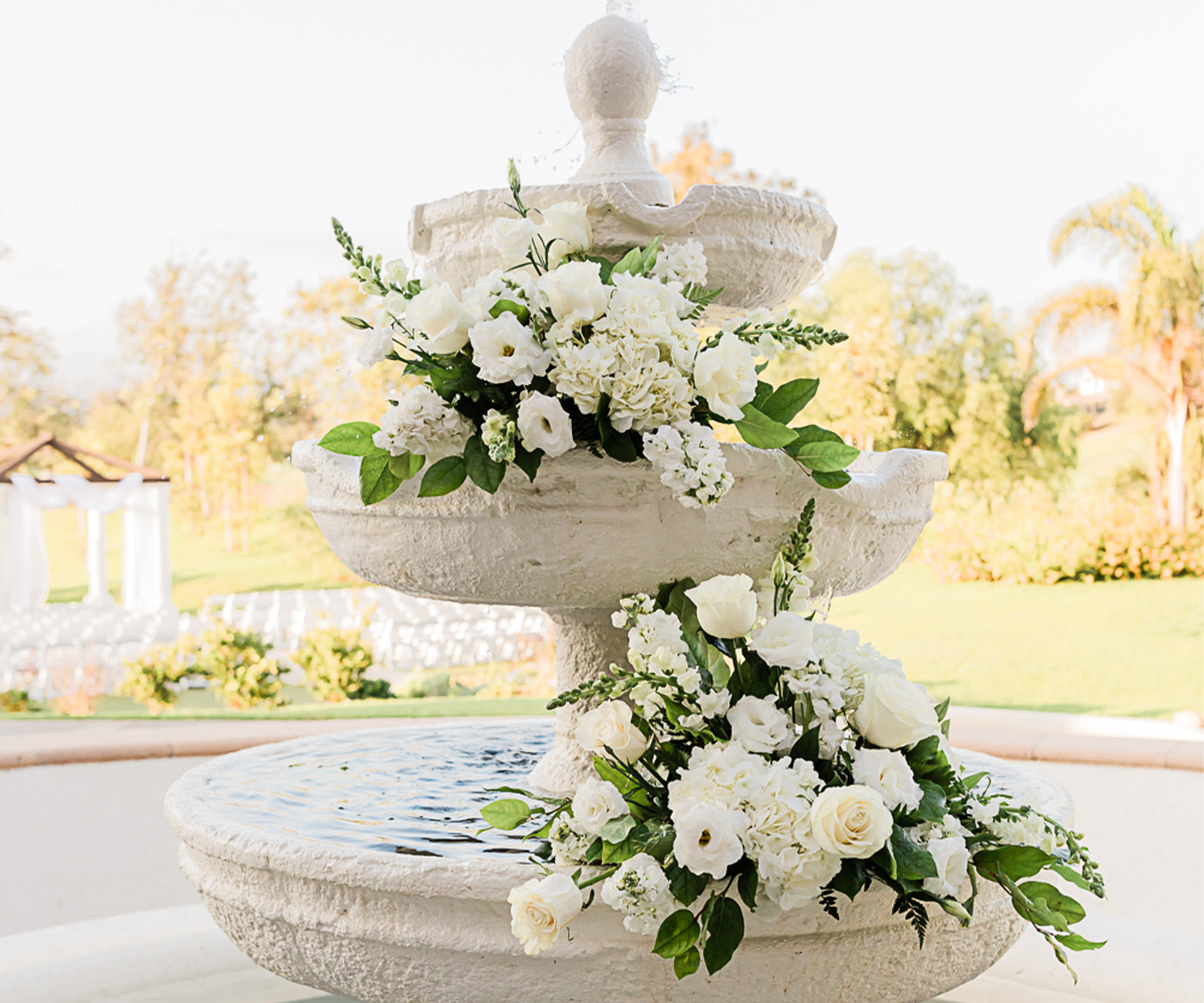 Fountain with flowers at Sterling Hills by Wedgewood Weddings