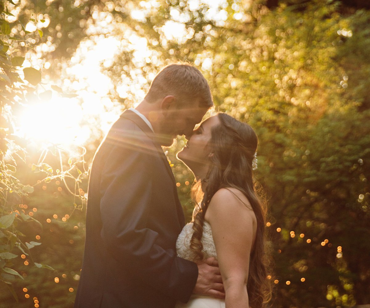Bride and groom posing at sunset - Tapestry House by Wedgewood Weddings