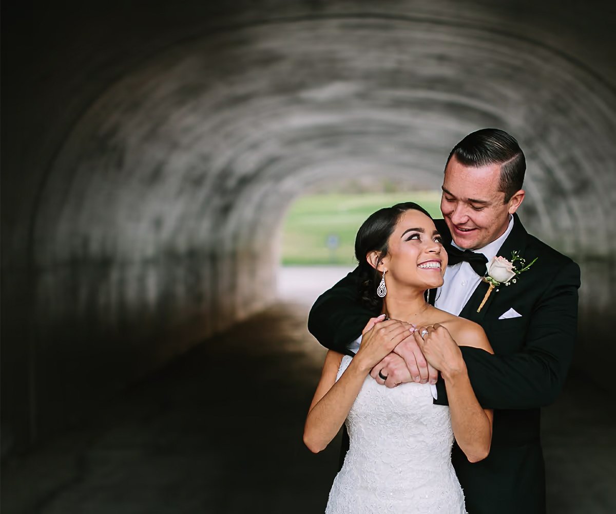 Couple in tunnel photo op at The Retreat by Wedgewood Weddings